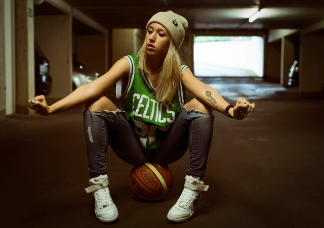 Athletic woman sitting basketball parking free wallpaper - medium preview image