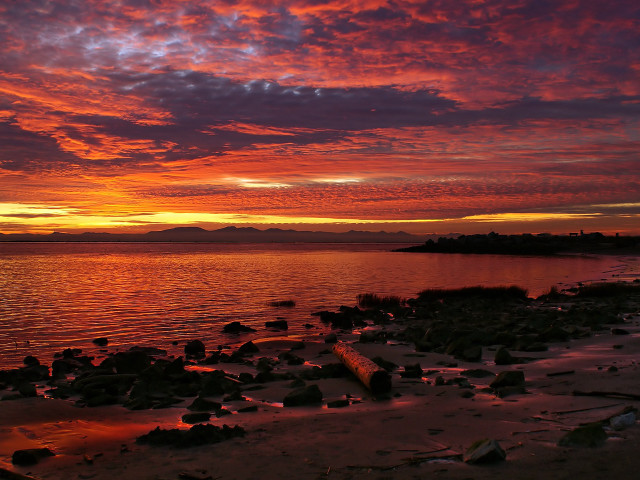 Sunset water rocks shore mountain free wallpaper - medium preview image