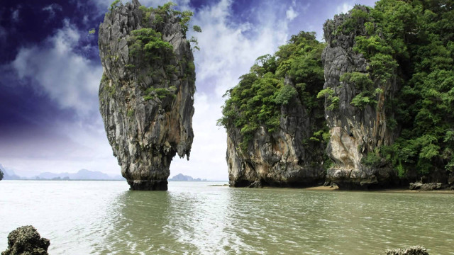 Rocks beach boat people standing free wallpaper - medium preview image