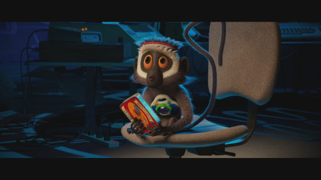 Monkey sitting chair book remote free wallpaper - medium preview image