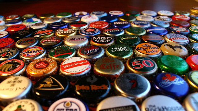 Bottle caps colored magnets table free wallpaper - medium preview image