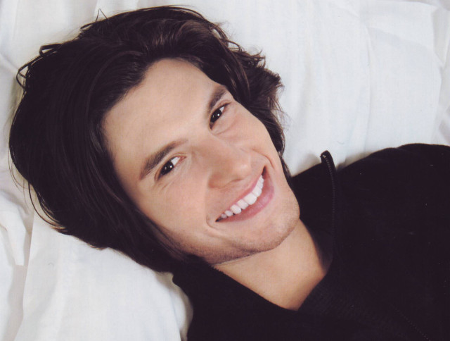 Man smiling bed eyes closed free wallpaper - medium preview image