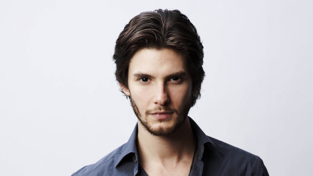 Bearded man blue shirt serious free wallpaper - medium preview image
