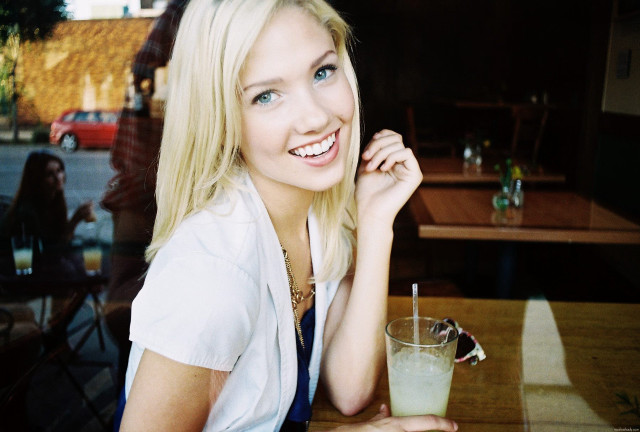 Woman sitting table drink glass free wallpaper - medium preview image