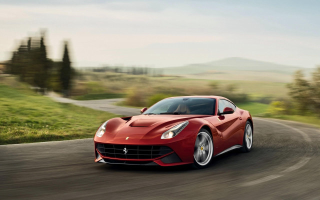 Red sports car driving countryside free wallpaper - medium preview image