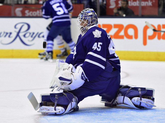 Hockey goalie sitting ice glove free wallpaper - medium preview image