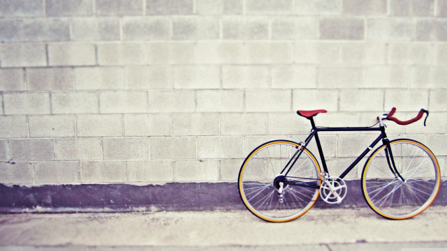 Bike parked street brick wall free wallpaper - medium preview image