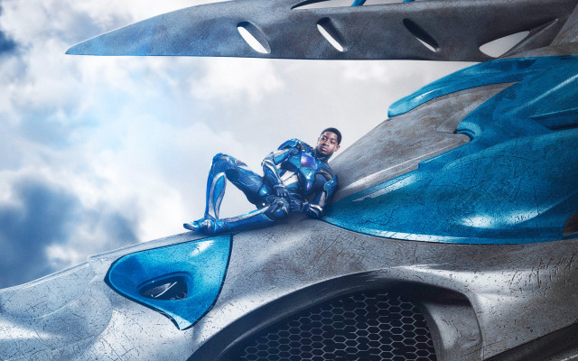 Futuristic man suit sitting car free wallpaper - medium preview image