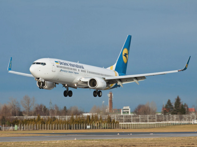 Jetliner flying blue sky runway #7 free wallpaper - medium preview image