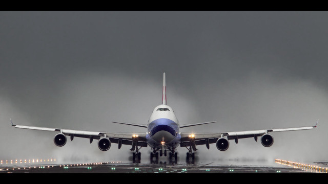 Jetliner takeoff dark clouds landing free wallpaper - medium preview image