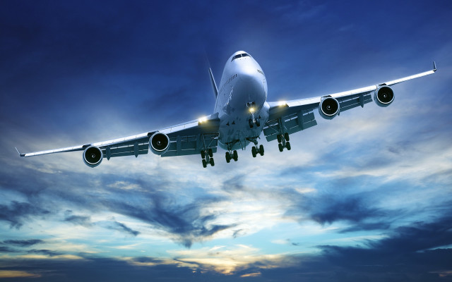 Jetliner flying cloudy blue sky #2 free wallpaper - medium preview image