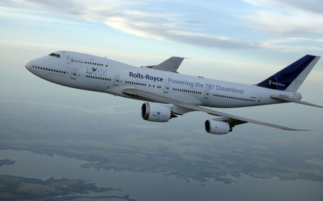 Jetliner cloudy sky water background free wallpaper for desktop - medium preview image
