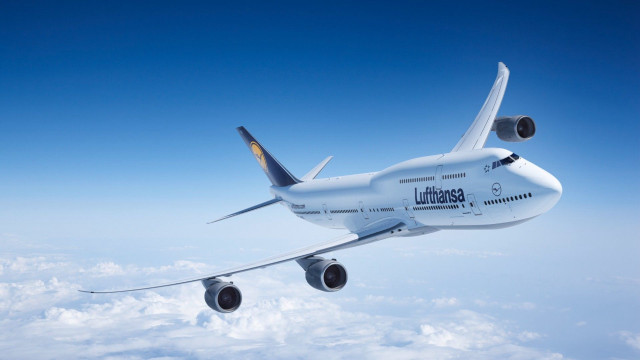 Jetliner golden tail tiltshift blue free wallpaper - medium preview image