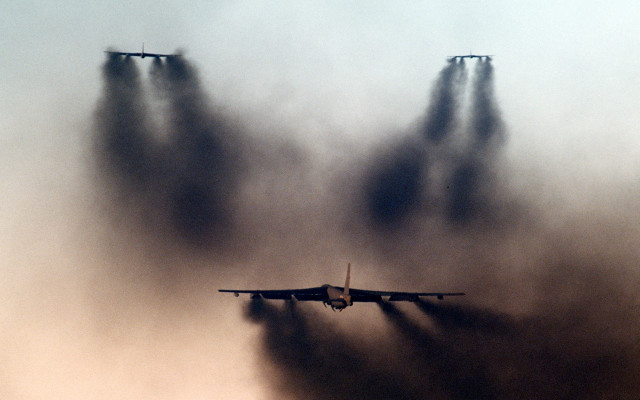 Plane flying smoke jets clouds free wallpaper - medium preview image