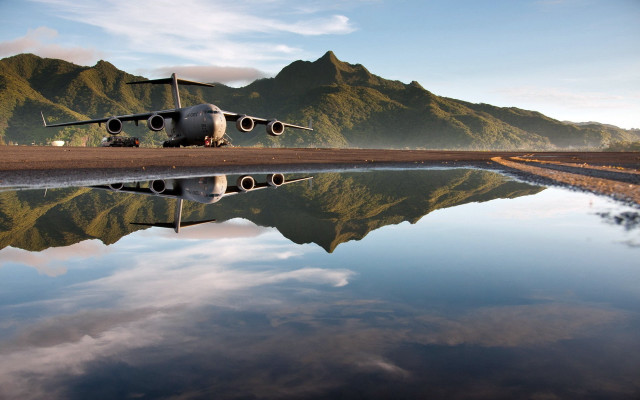 Plane tarmac mountain range water free wallpaper - medium preview image
