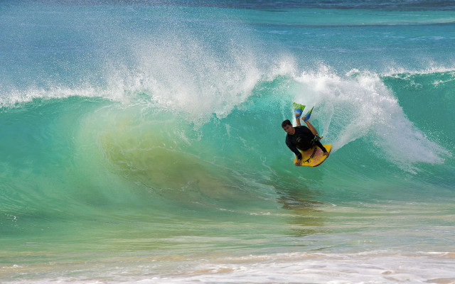 Man riding wave surfboard ocean #37 free wallpaper - medium preview image