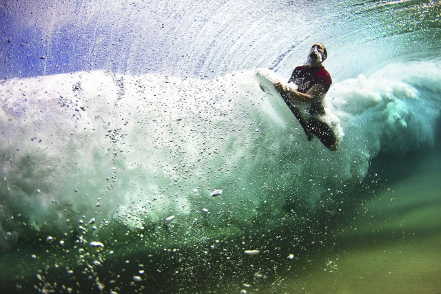 Man riding wave surfboard ocean #11 free wallpaper - medium preview image