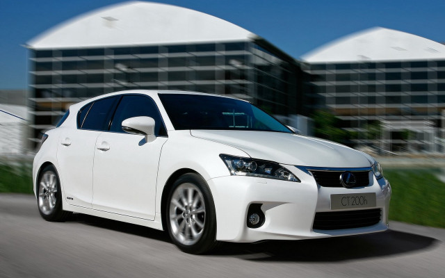 White car driving street building #4 free wallpaper - medium preview image