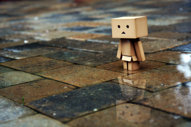 Cardboard toy sad face tiled free wallpaper - medium preview image