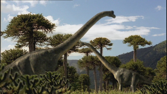 Dinosaurs field trees bushes sky free wallpaper - medium preview image
