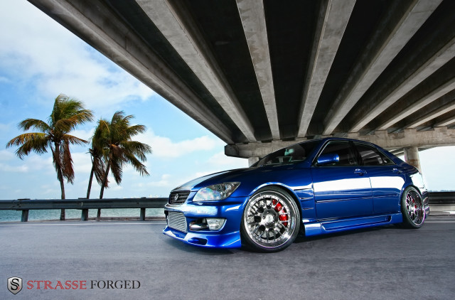 Blue car parked bridge water #2 free wallpaper - medium preview image