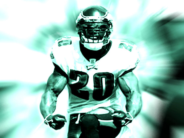 Football player running ball blurry free wallpaper - medium preview image