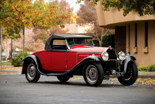 Red black car parked road free wallpaper - medium preview image
