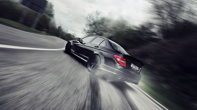 Black car road trees cloudy free wallpaper - medium preview image