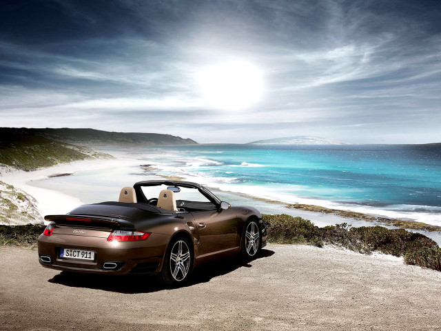 Brown sports car ocean beach free wallpaper - medium preview image