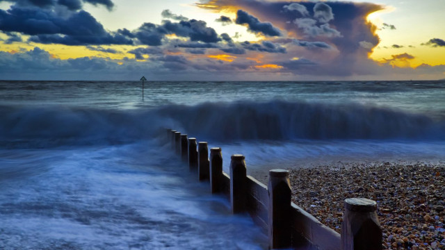 Beach waves fence sunset clouds free wallpaper - medium preview image