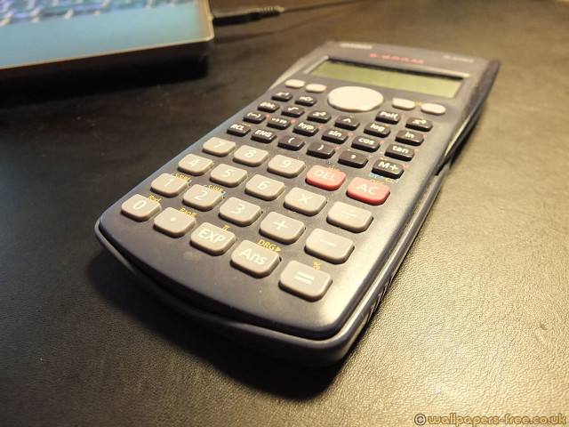 Calculator laptop table black surface free wallpaper - medium preview image