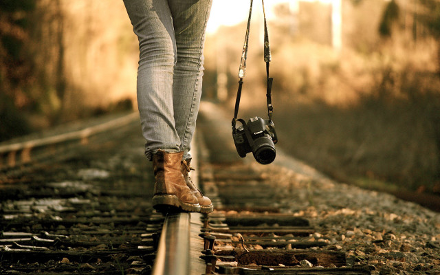 Person walking train track camera free wallpaper - medium preview image