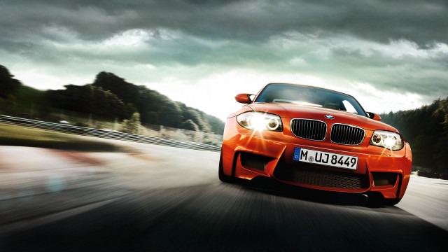 Red car driving road cloudy #3 free wallpaper - medium preview image