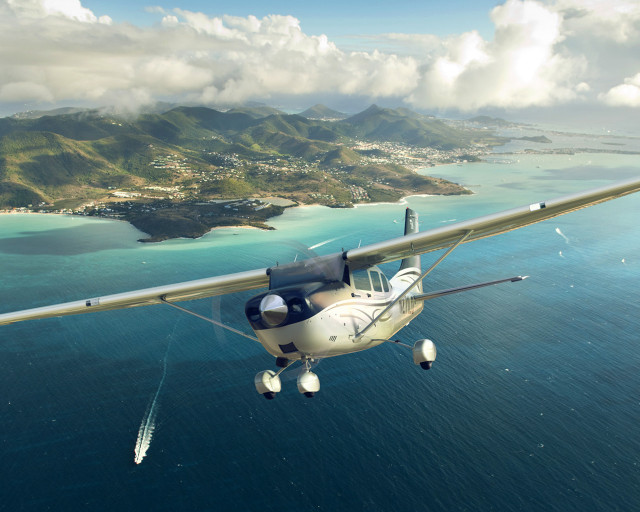 Small plane over water mountain free wallpaper - medium preview image