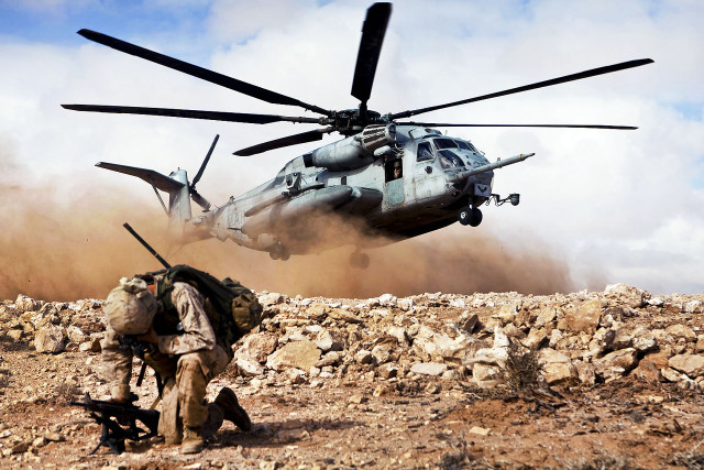 Helicopter rocky terrain man walking free wallpaper - medium preview image