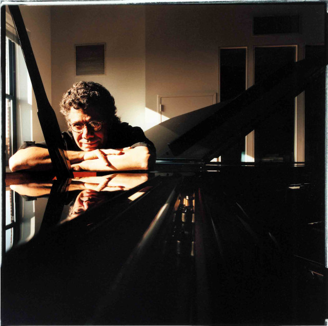 Man leaning piano room window free wallpaper - medium preview image