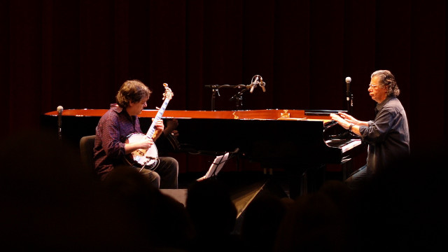 Two people piano microphone stand free wallpaper - medium preview image