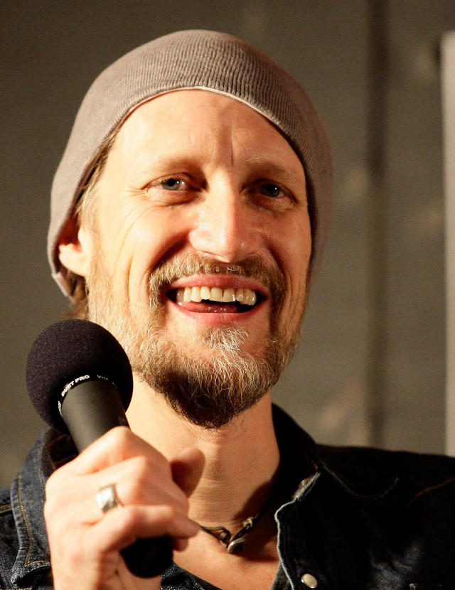 Bearded man beanie microphone portrait free wallpaper - medium preview image