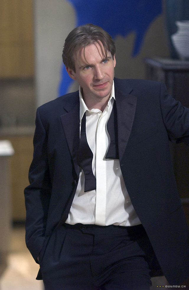 Man suit tie sitting pointing free wallpaper - medium preview image