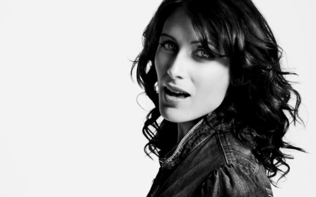 Woman leatherjacket posing blackandwhite promotional free wallpaper - medium preview image