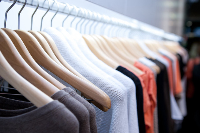 Rack of clothes hanging wall free wallpaper - medium preview image