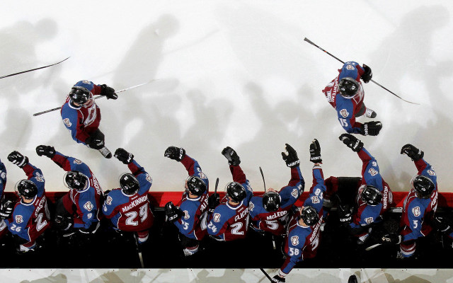 Ski stunt uniformed performers crowd free wallpaper - medium preview image