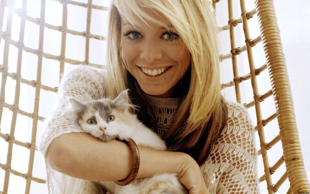 Woman holding cat smiling camera free wallpaper for desktop - medium preview image