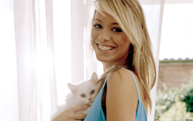 Woman holding white cat smiling free wallpaper - medium preview image