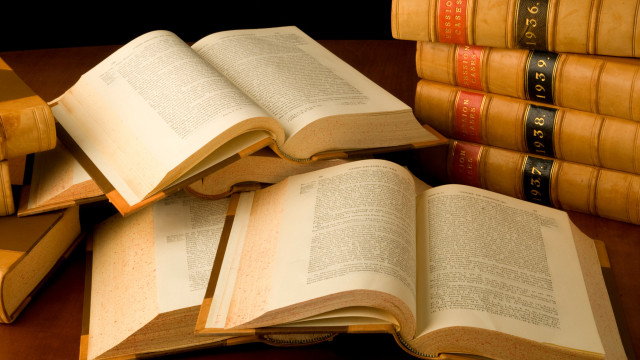 Stack of books on wooden free wallpaper - medium preview image