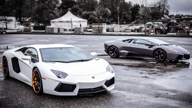 Two white sports cars rainy free wallpaper - medium preview image