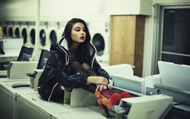 Woman laundry machine laptop stack free wallpaper - medium preview image