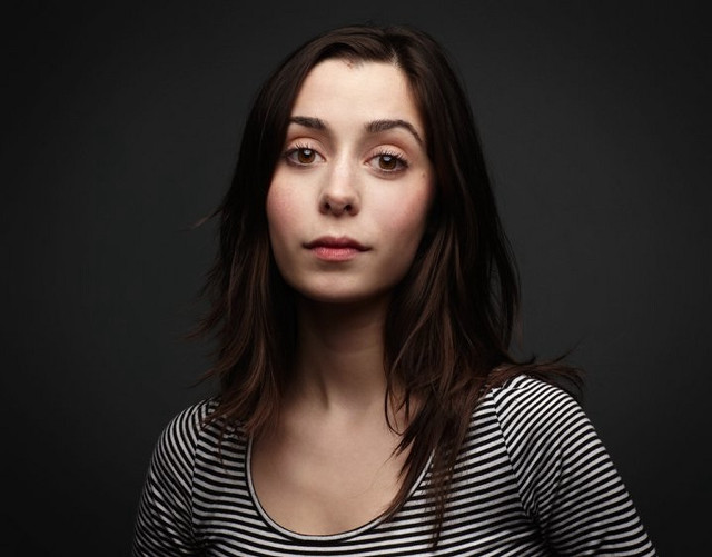 Woman striped shirt black background free wallpaper - medium preview image