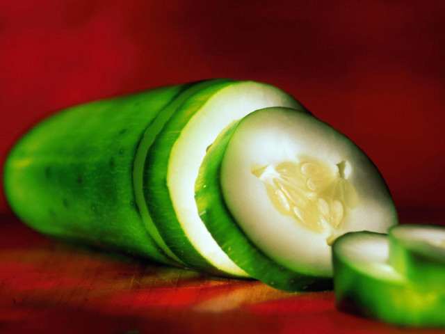 Cucumber sliced red surface background free wallpaper - medium preview image