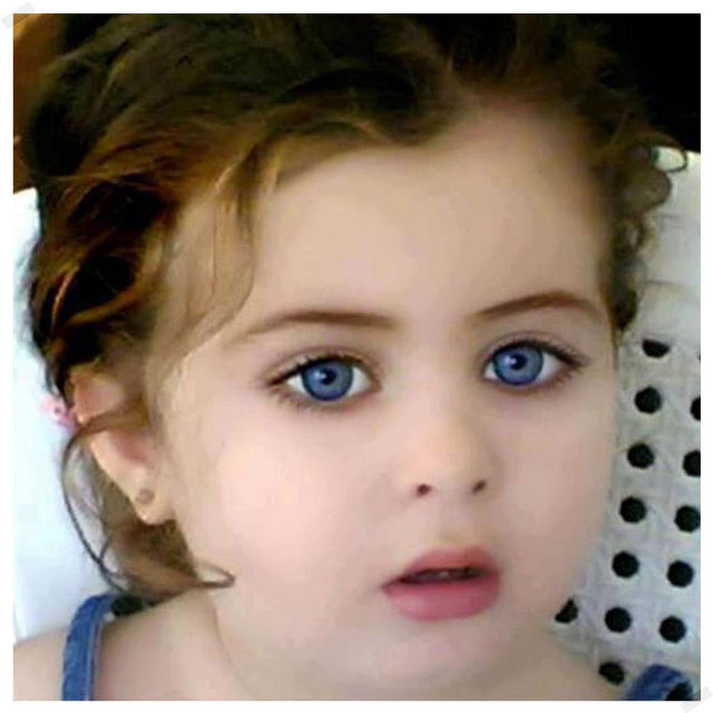 Little girl blue eyes serious #2 free wallpaper - medium preview image